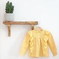 Mavis Top Ochre.  Ruffle and Pom Pom Detail